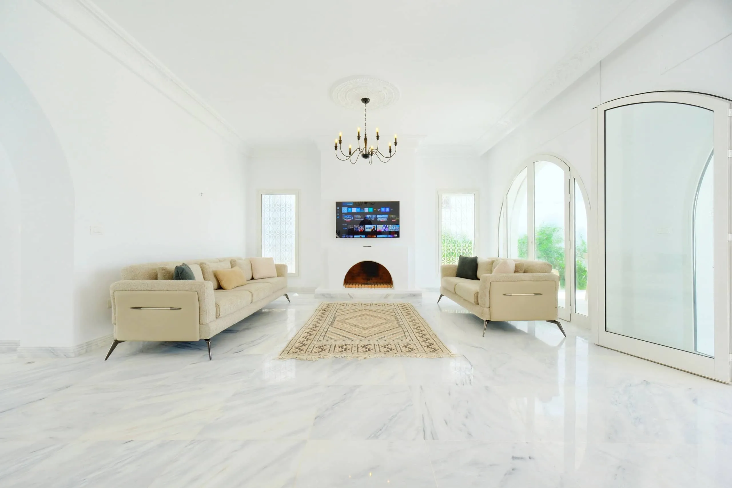 The bright living room with marble floors