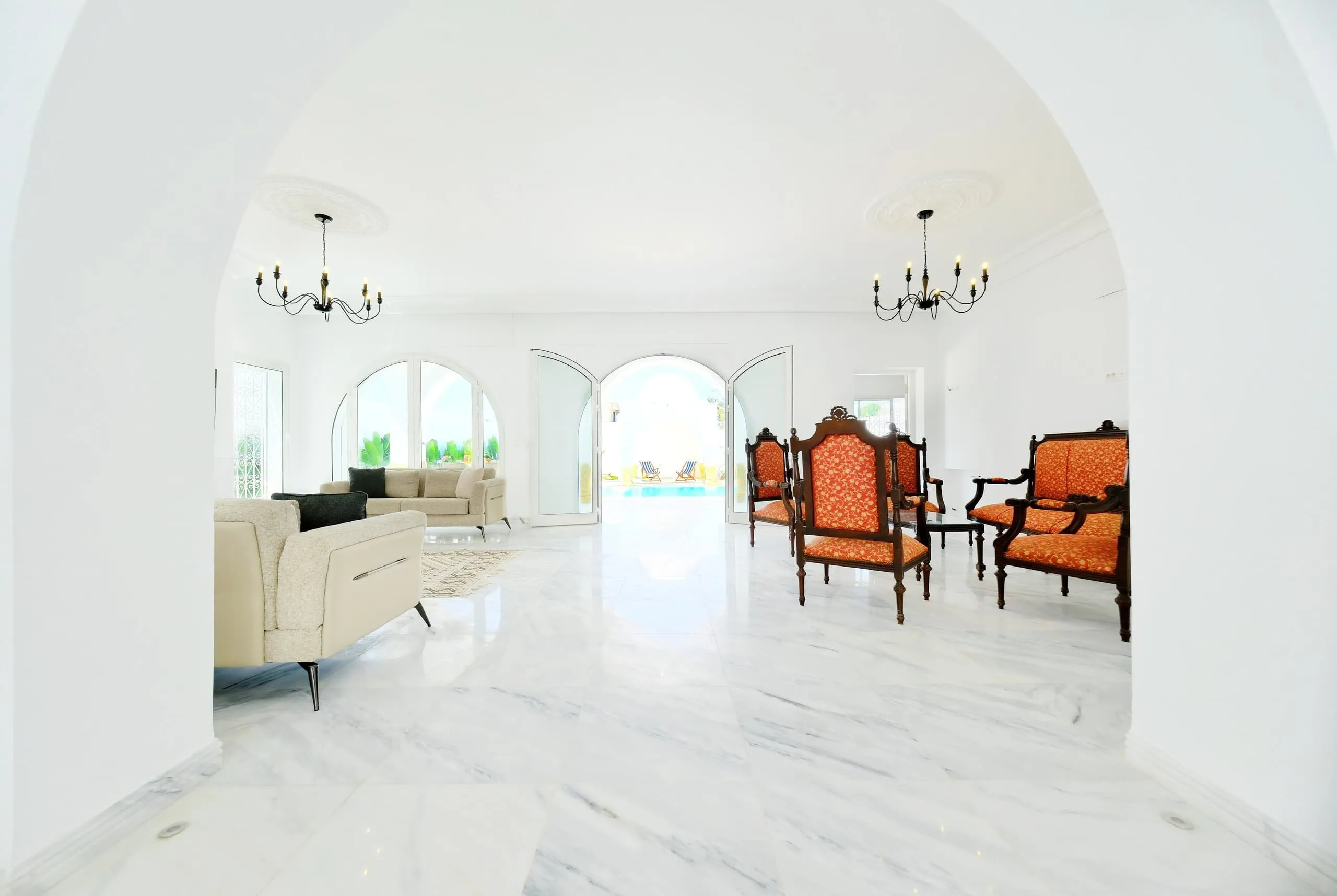 The bright living room with marble floors