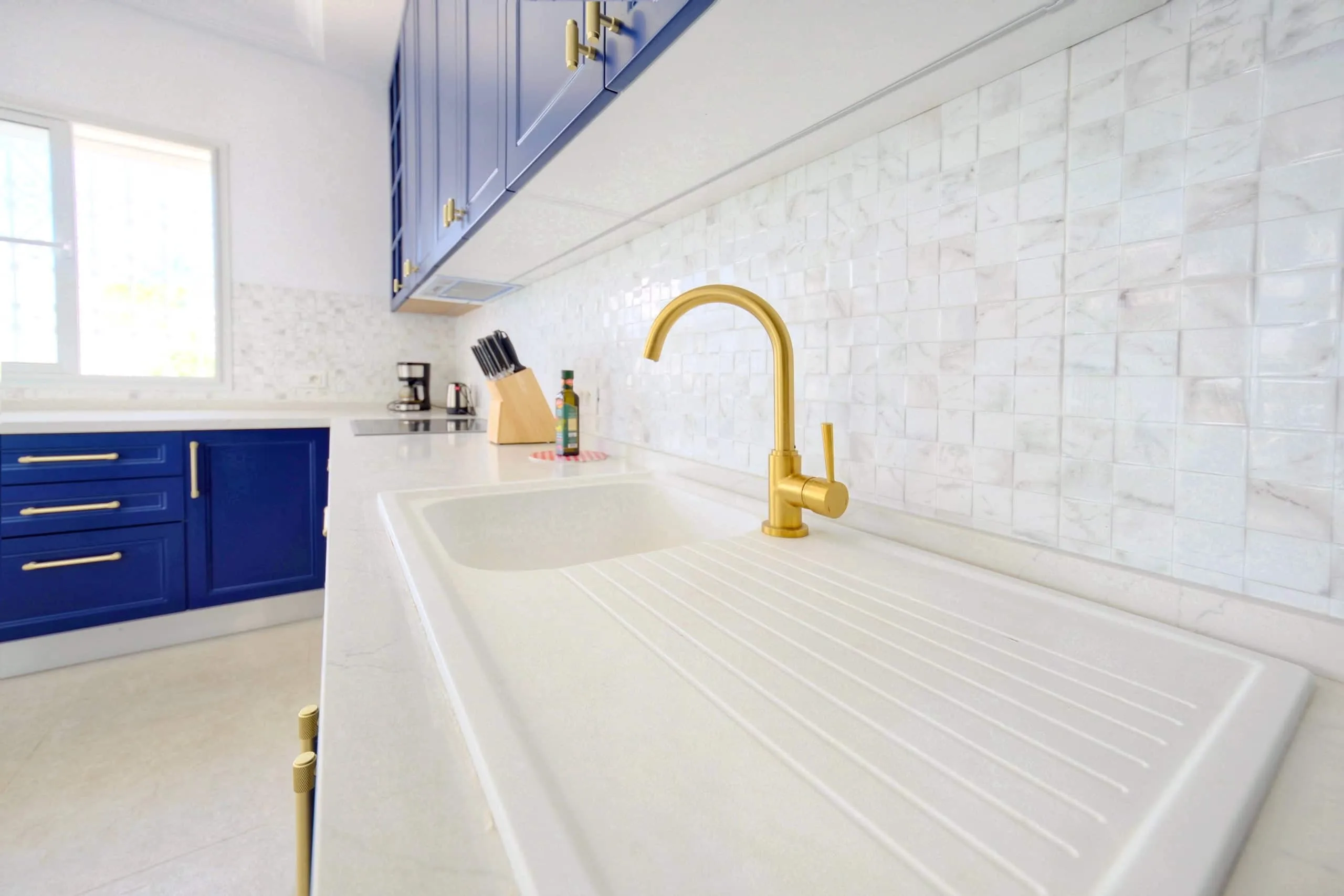 The fully equipped blue kitchen